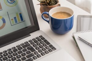 high-angle-laptop-coffee-assortment